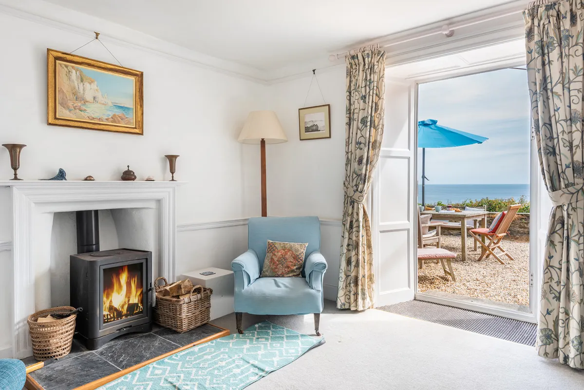 The lounge with log burner and access to the terrace