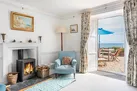 The lounge with log burner and access to the terrace