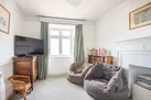 The snug, also with sea views over the village and ley
