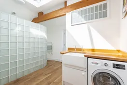 The utility and shower room off the kitchen-perfect for rolling off the beach
