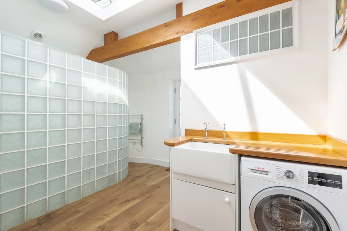The utility and shower room off the kitchen-perfect for rolling off the beach