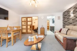 Sitting room with doors to snug room and kitchen