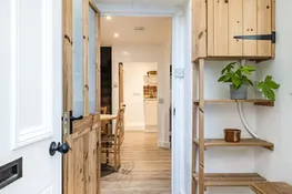 Meads Cottage, Charmouth: A stylish and functional porch shoe rack designed to keep your entryway organised