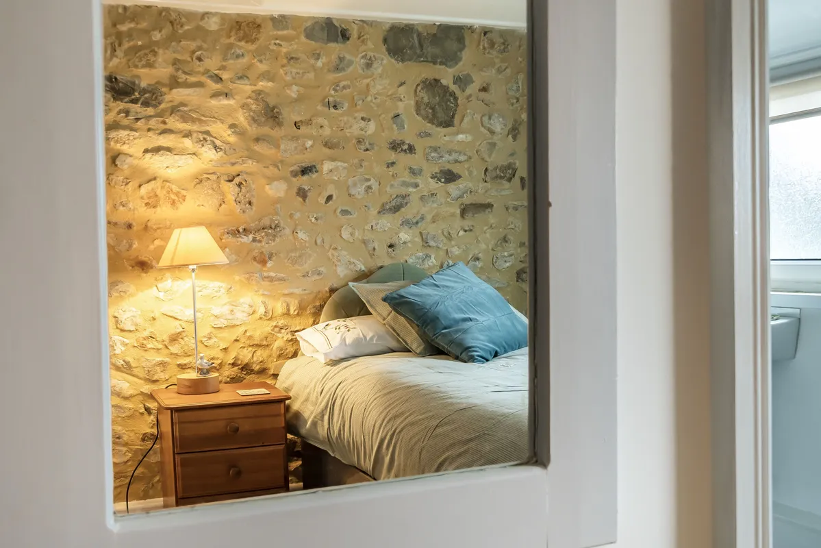 Meads Cottage, Charmouth: Such beautiful exposed stone in bedroom two