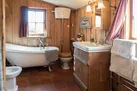 Bathroom with roll top bath, sink, toilet and bidet