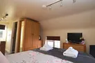 Relax on to the comfortable bed in this romantic retreat