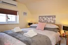 The bedroom has a juliette balcony with wonderful views over the garden
