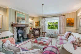 The seating area in the drawing room with log burner.