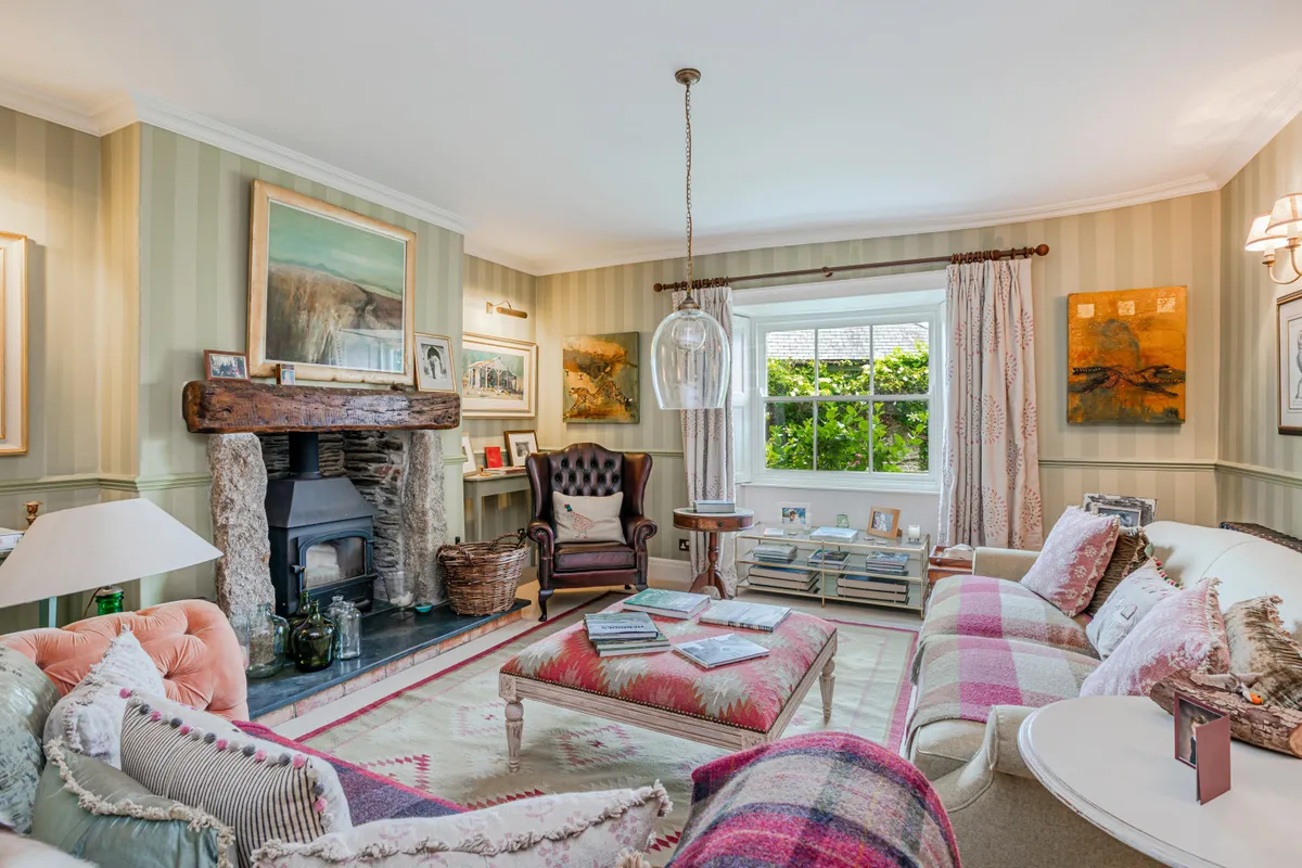 The seating area in the drawing room with log burner.