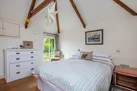 another view of The Apple Store bedroom with further door to the path to the house.
