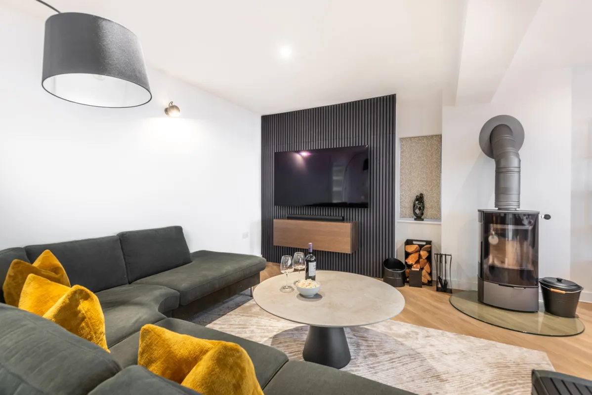 Modern interiors with a cosy log burner for cooler evenings and a romantic feel.