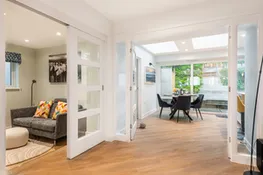 The snug, and a peek through to the kitchen with breakfast table.