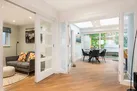 The snug, and a peek through to the kitchen with breakfast table.