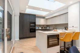 The well equipped modern kitchen with breakfast bar and wine fridge!
