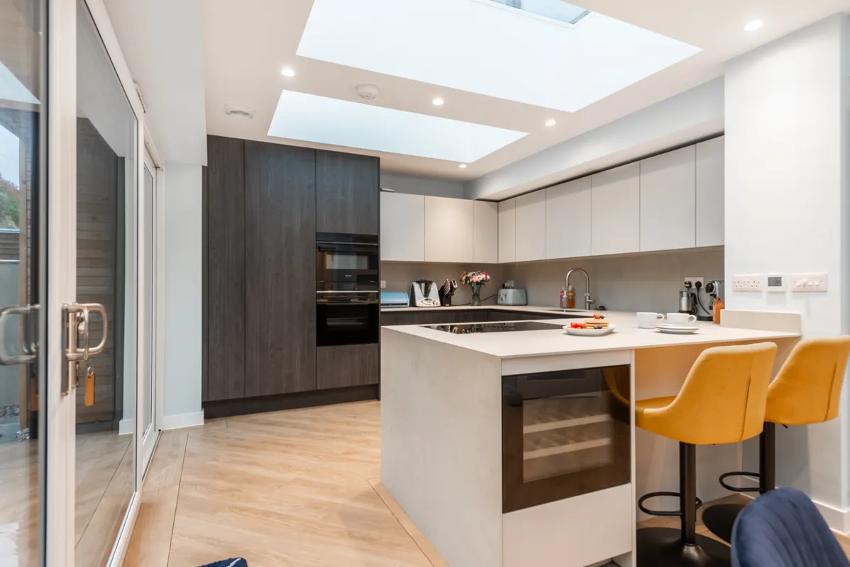 The well equipped modern kitchen with breakfast bar and wine fridge!