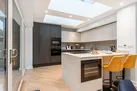 The well equipped modern kitchen with breakfast bar and wine fridge!