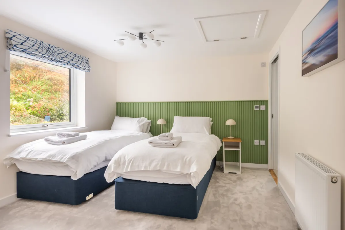 Bedroom 2 with garden views and an en suite shower room.