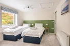Bedroom 2 with garden views and an en suite shower room.