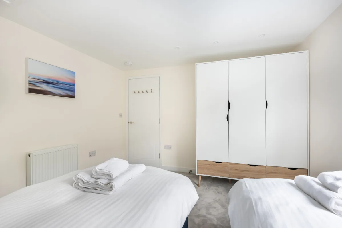 Bedroom 2 with twin 3 ft beds that can be accommodated as a super king.
