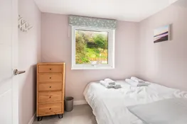 Another view of bedroom 3 with garden views.