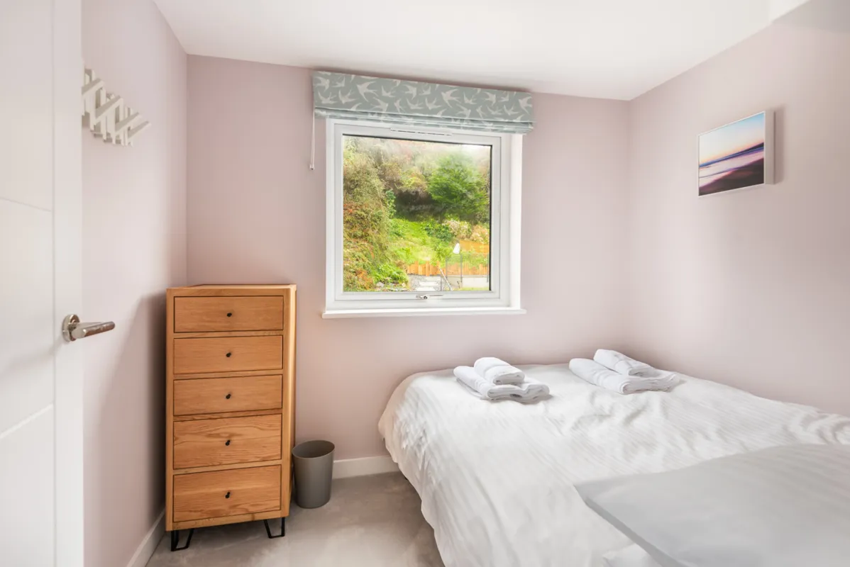 Another view of bedroom 3 with garden views.
