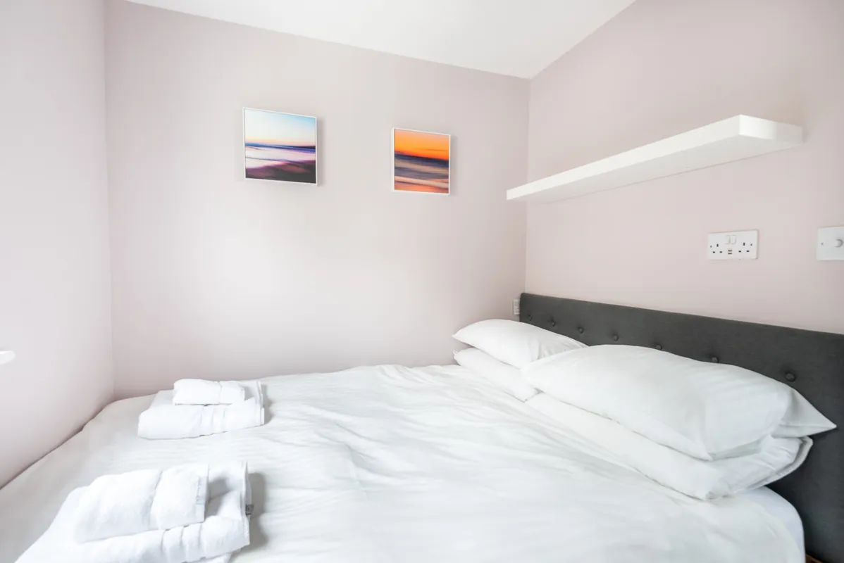 Bedroom 3, with 4'6'' double bed and garden views.
