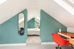 Glimpsing from the hall into the second floor bedroom.