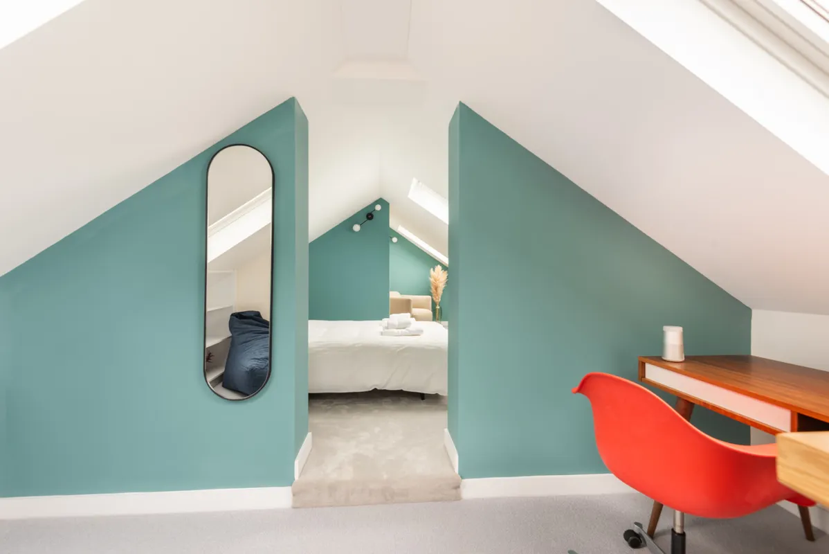 Glimpsing from the hall into the second floor bedroom.