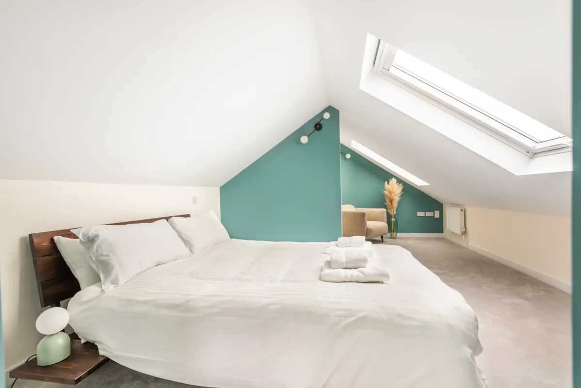 The second floor bedroom with velux windows and sea views.