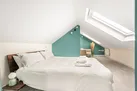 The second floor bedroom with velux windows and sea views.