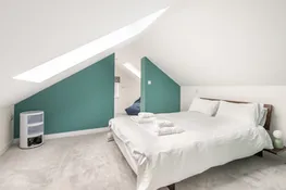 The second floor bedroom (bedroom 4) with sea views from velux windows.