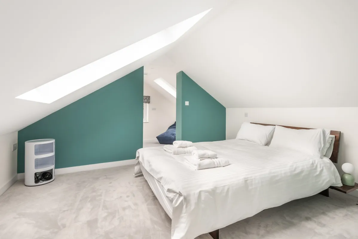 The second floor bedroom (bedroom 4) with sea views from velux windows.