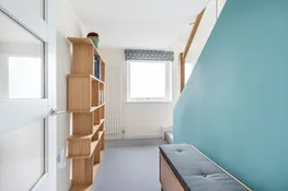 The first floor hall with steps to the second floor.