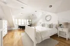 Master bedroom with roll top bath in window - Happy Days Cottage