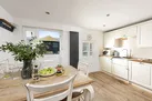 Dining table in kitchen and dining area - Happy Days Cottage
