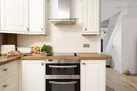 Oven, hob and toaster in kitchen area - Happy Days Cottage
