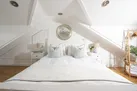 King size bed, bedside tables and tamps in master bedroom - Happy Days Cottage