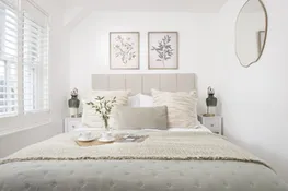 Bedroom two with bed, bedside tables and drawers - Happy Days Cottage