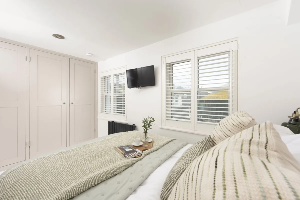 Built in wardrobe in bedroom two - Happy Days Cottage