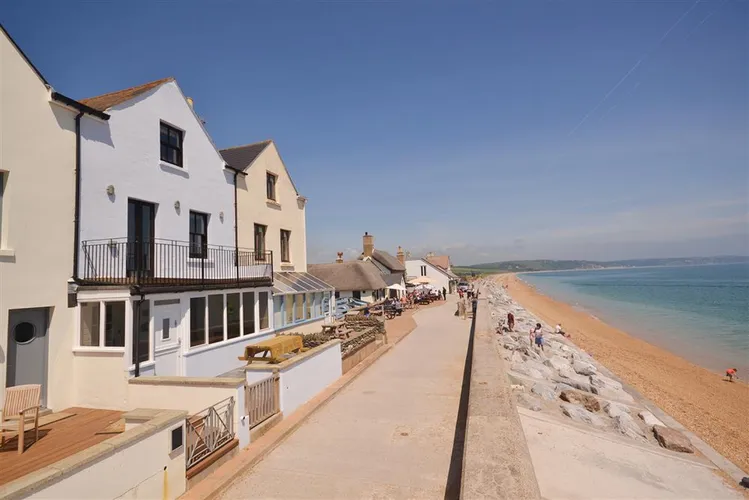 Shingle House (in light blue) overlooking the seafront at Torcross.