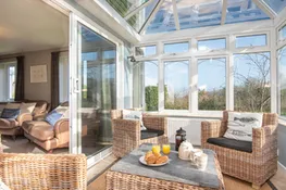 The conservatory gives another space to relax.