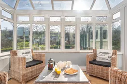 When the sun is hiding, get a feel of al fresco in the conservatory.