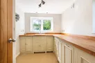 Very useful utility room with freezer, washing machine and tumble dryer, drying rack and sink