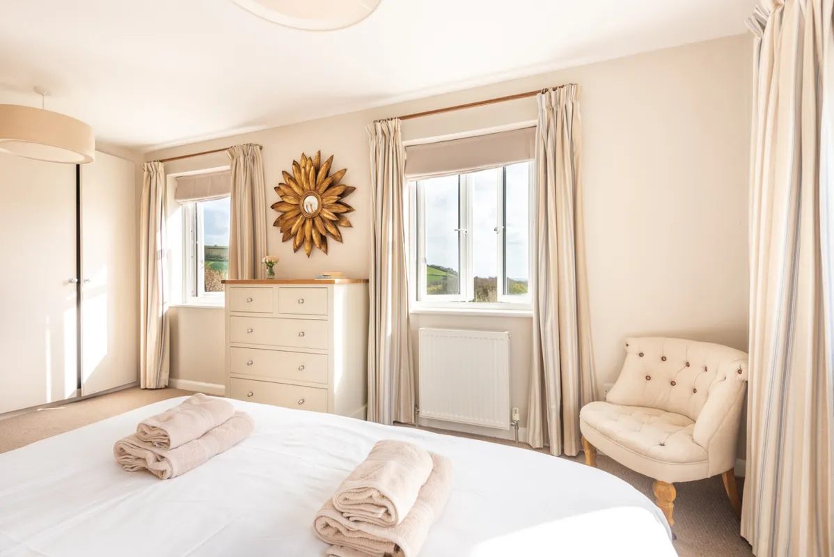Another view of bedroom 1 with countryside views and sea glimpses