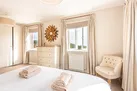 Another view of bedroom 1 with countryside views and sea glimpses