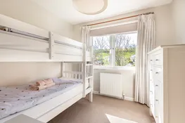 Bedroom 4, with garden and green views and bunk beds