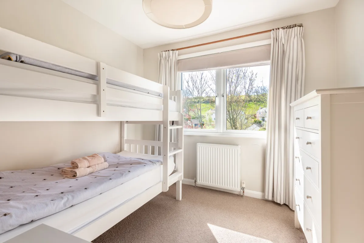 Bedroom 4, with garden and green views and bunk beds