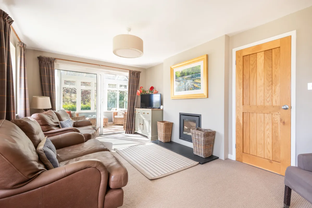 Another view of the lounge with log burner for cosy idyllic winter retreats.