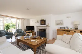 The White House, West Lulworth: Sitting room with wood burning stove