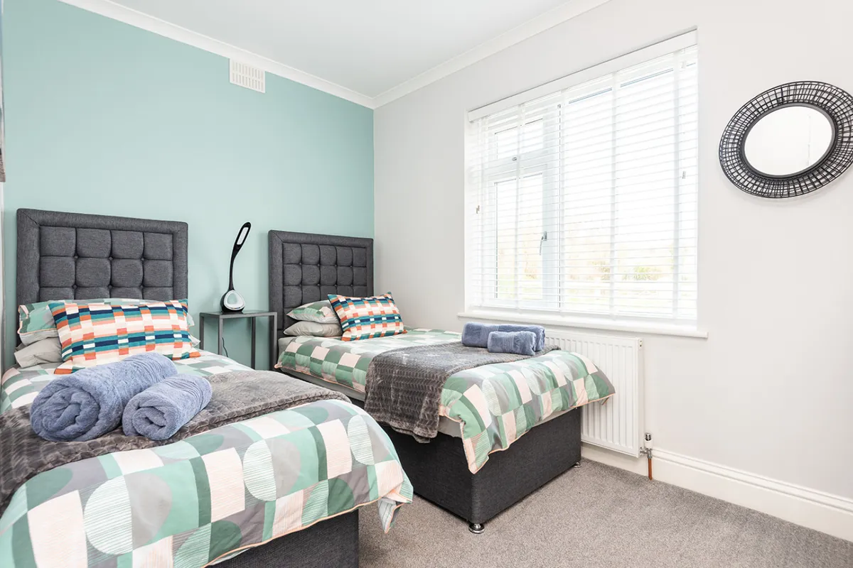 The twin bedroom on the ground floor with view over the front of Middlecombe, and a sea glimpse!